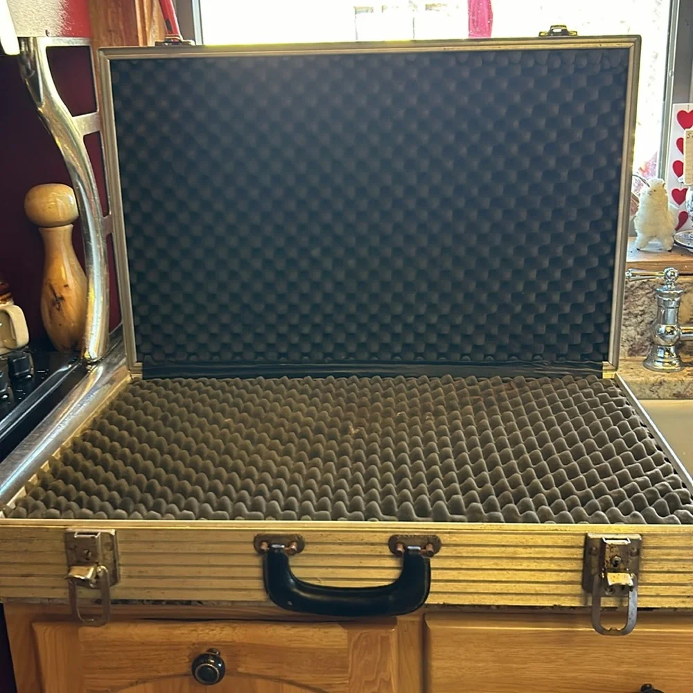 Aluminum padded case, handy for carrying anything; 24”long, 13.5”wide 4” deep